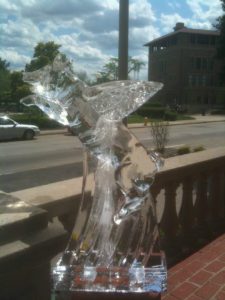 closeup shot of a 3D Ice Sculpture of a pig with wings