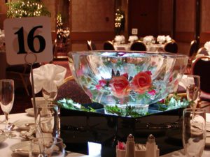 a beautiful Ice Sculpture of a bowl with roses