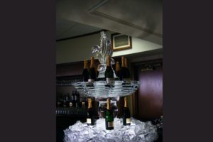 an ice sculpture with wine bottles on it