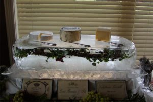 Three types of cheese placed on the ice slab