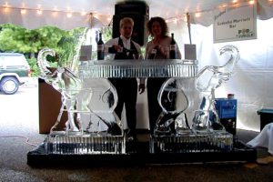 a man and woman having a drink at the bar counter