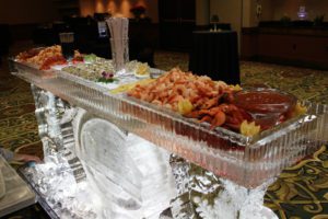 Ice Sculpture Table with Food Items on it