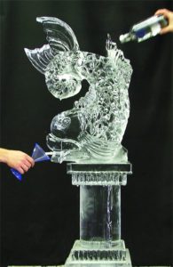 Ice Sculpture of a Fish with a Container