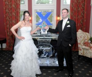 a bride and groom with drinks in their hands